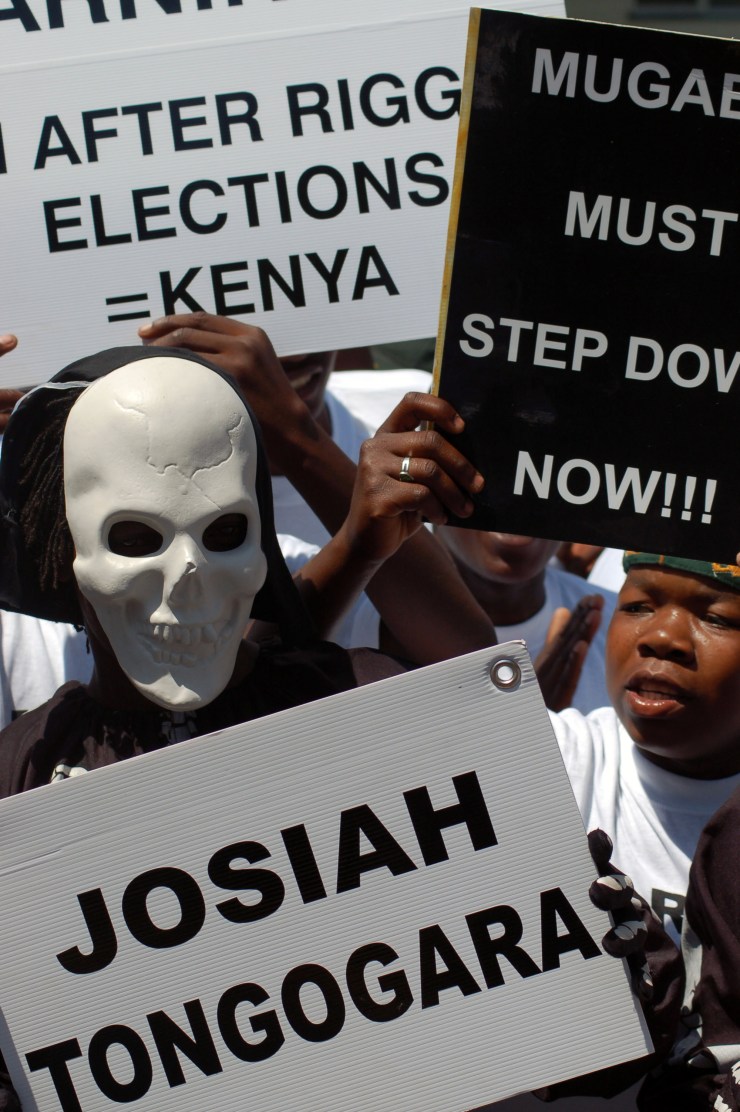 Exiled Zimbabweans protest outside the country's consulate in Pretoria, South Africa