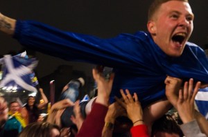 A 'yes' supporter crowdsurfing in George Square, Glasgow as Scots awaited results on referendum night.