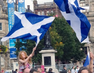 A young girl waves the Scottish flag on referendum day in George Square, Glasgow.