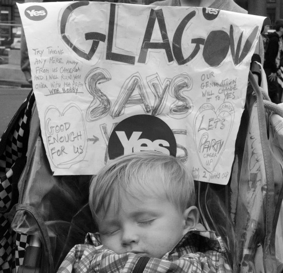 A child sleeps in George Square the day following the referendum. Many voters in Scotland's largest city have vowed to punish the ScottishLabour party for it's opposition to independence. 