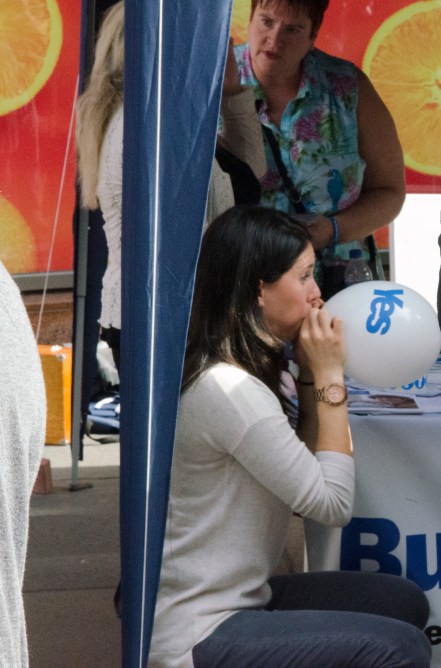 A woman blows up 'yes' campaign balloons in central Glasgow on the eve of the Scottish referendum.